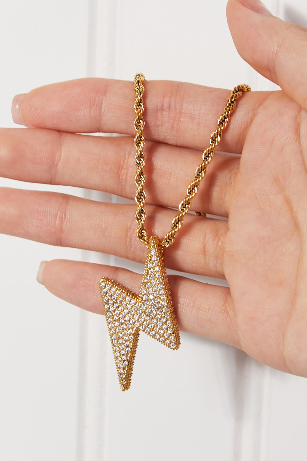 trendy gold lightning necklace close up sparkle detail