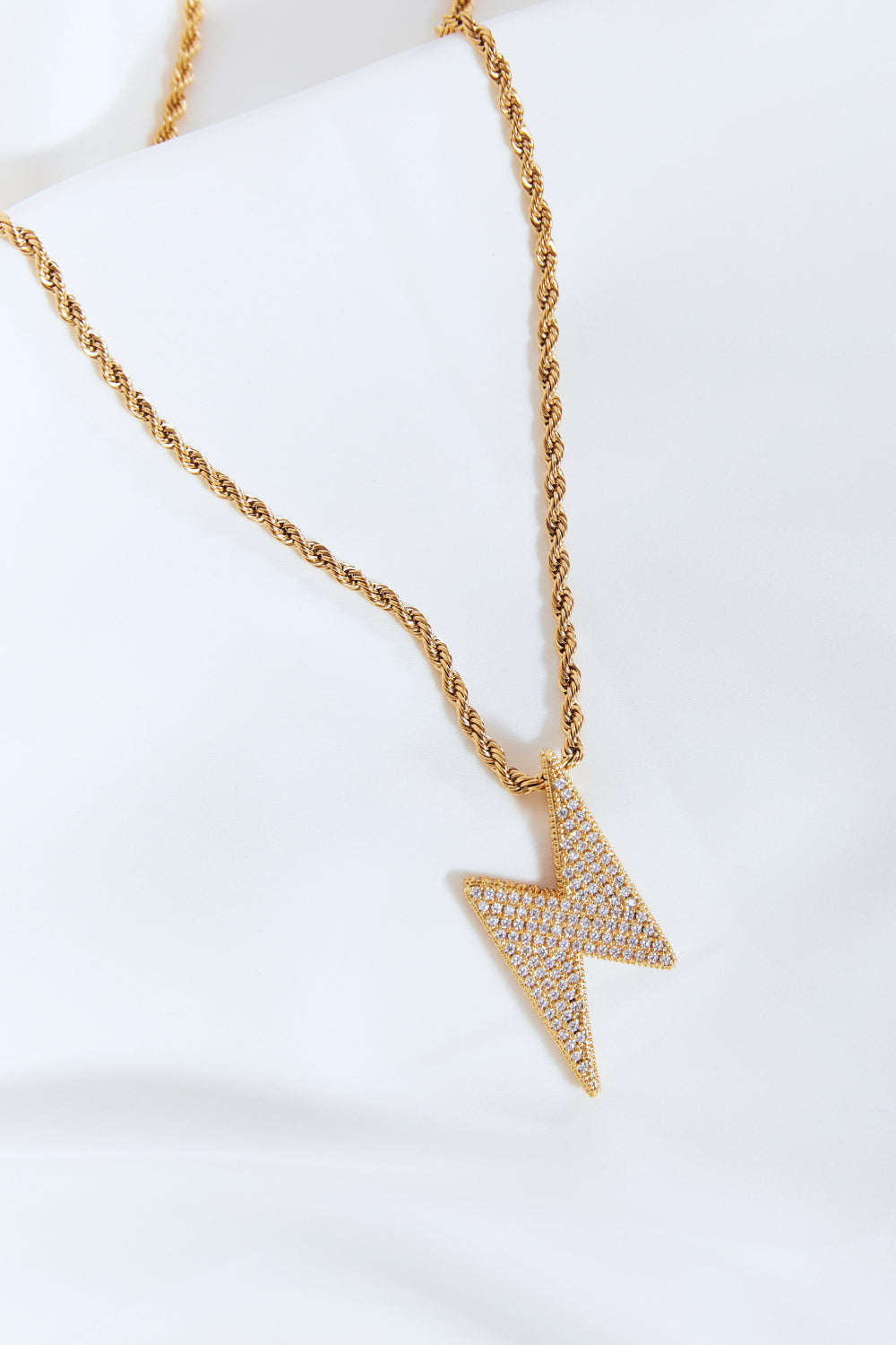 layered gold necklace lightning charm fashion look